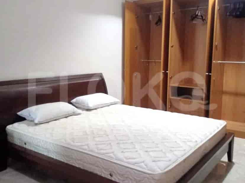 Bedroom with a bed and wardrobe.