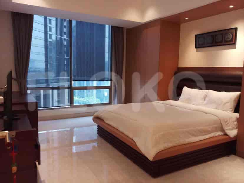 Master bedroom with a large bed and a view.