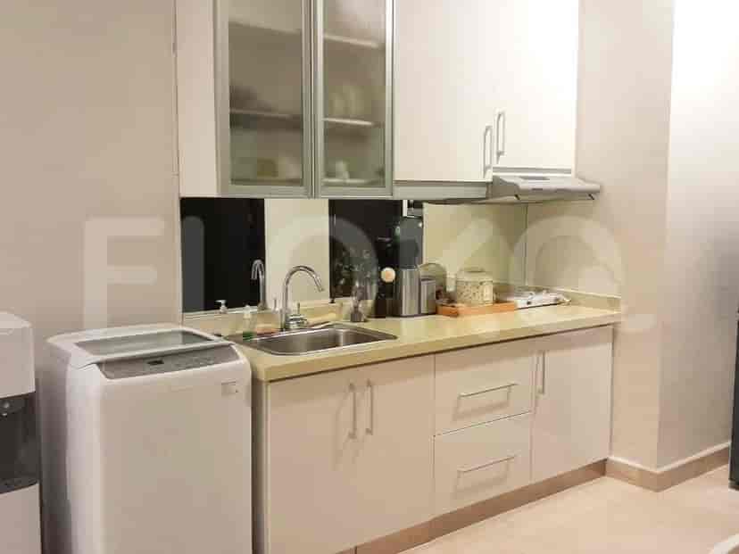 Modern kitchen with a sink, cabinets, and appliances.
