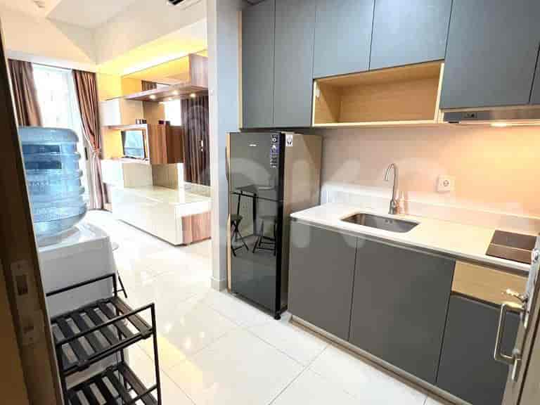 A modern kitchen equipped with appliances and ample storage space.
