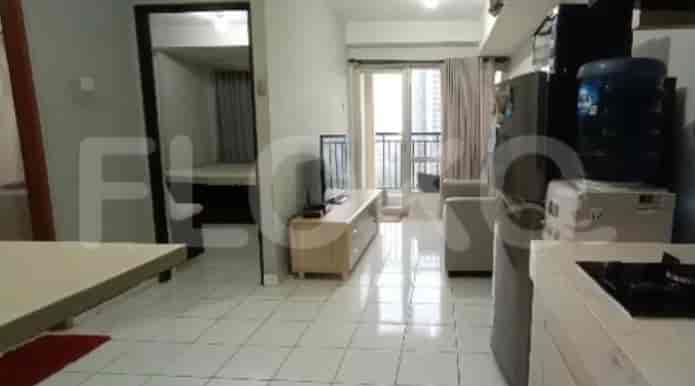A combination of living, dining and bedroom space showcasing a well-utilized layout.