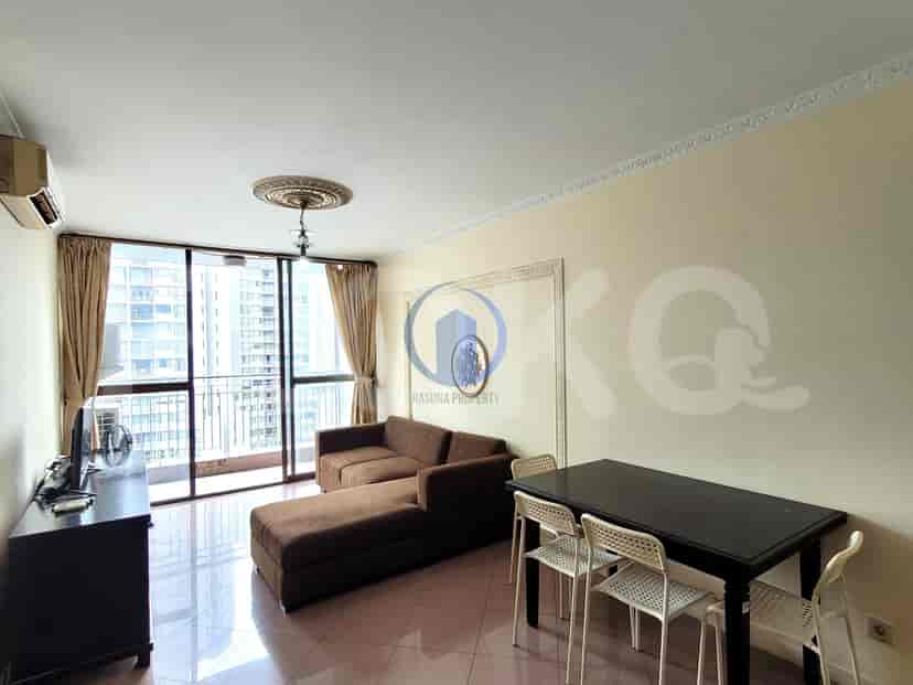 Living room with a brown sectional sofa, dining table, and access to a balcony.