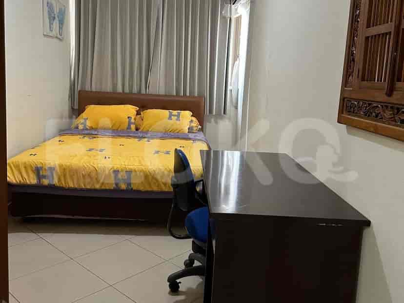 Bedroom with a bed and study desk.