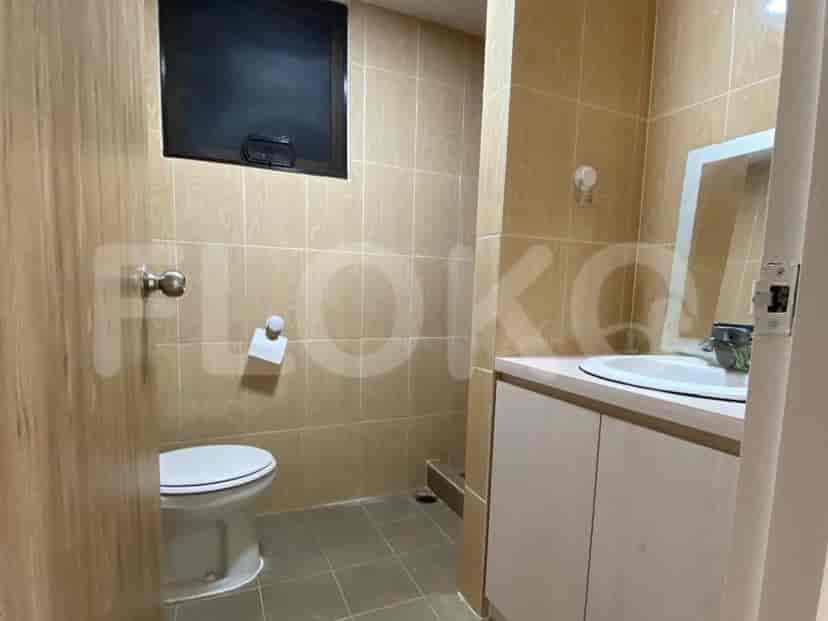 A bathroom with a toilet and sink.