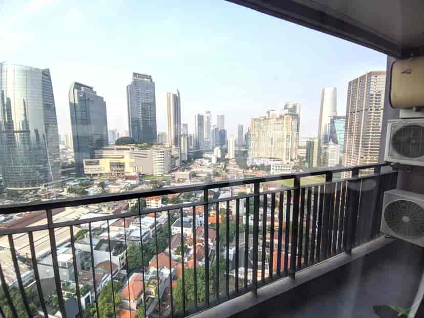A balcony with a city view.