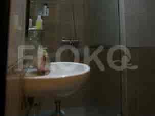 Bathroom featuring a sink and shower area.