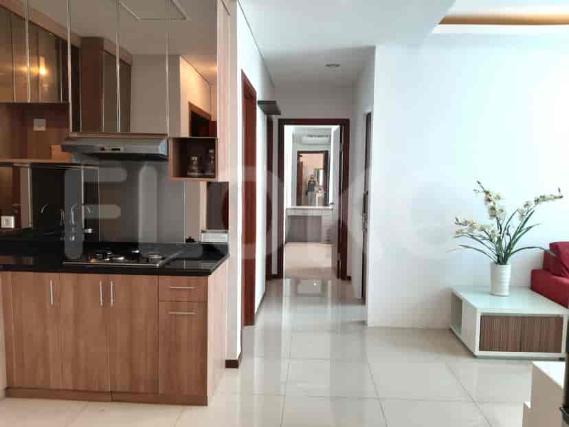 Open kitchen with a hallway leading to bedrooms.