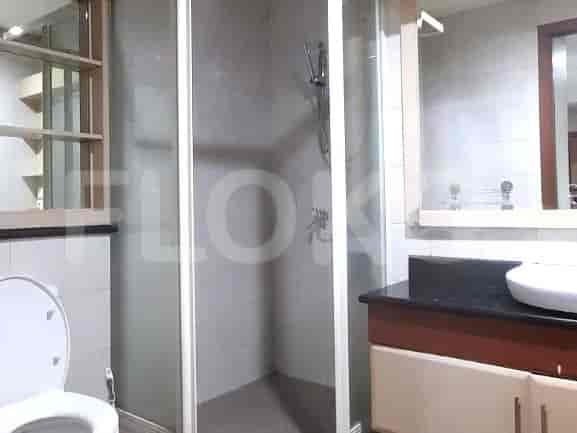 A modern bathroom with a shower and sink.