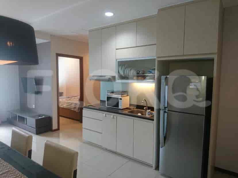 A kitchen and dining area with modern appliances and stylish decor.