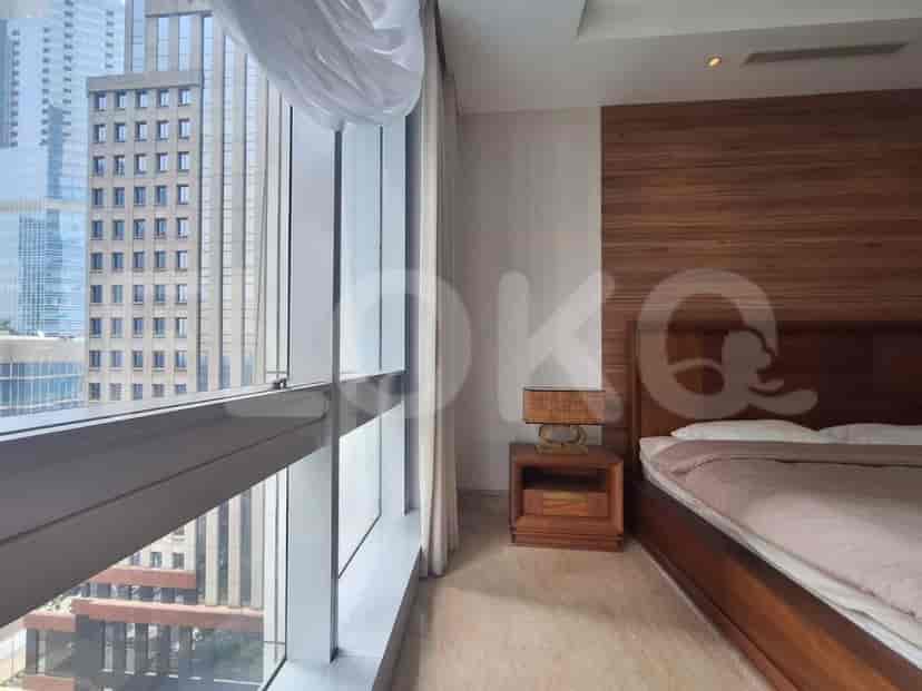 Bedroom with a view and a bed.