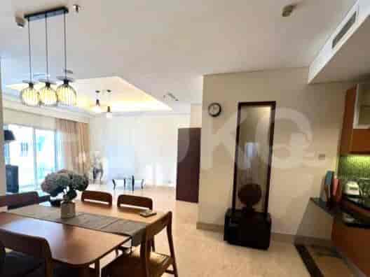 A combined dining and living area with modern furniture and design.