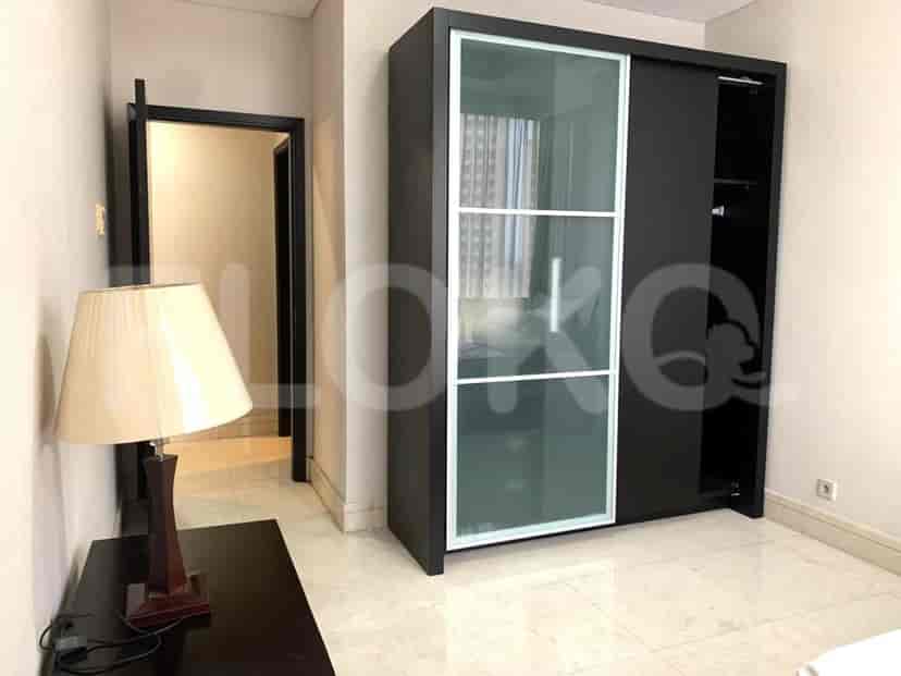 Bedroom with a closet and a coffee table.