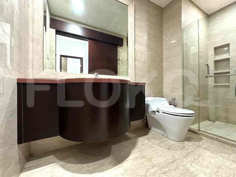A modern bathroom with a sink and a toilet.