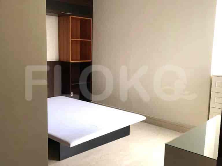 Bedroom with a bed and shelf.