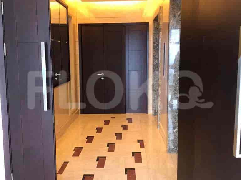 Hallway with doors and mirrors.