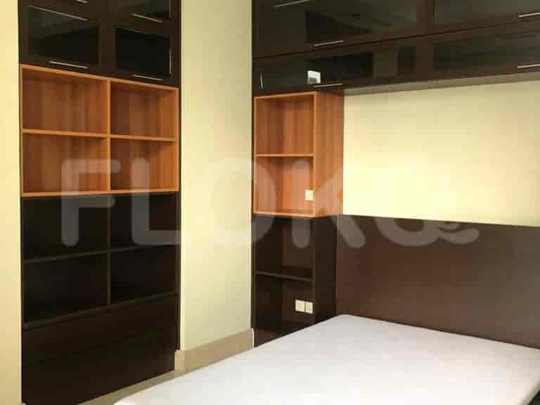 Bedroom with built-in storage and a bed.