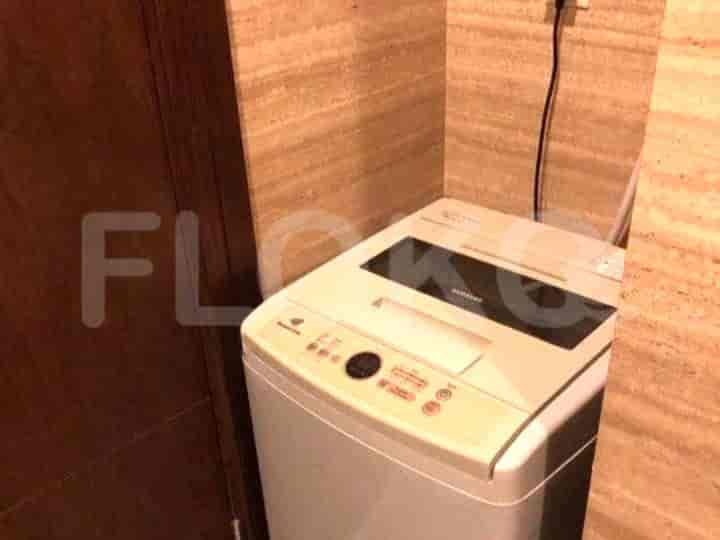 A washing machine inside the bathroom.