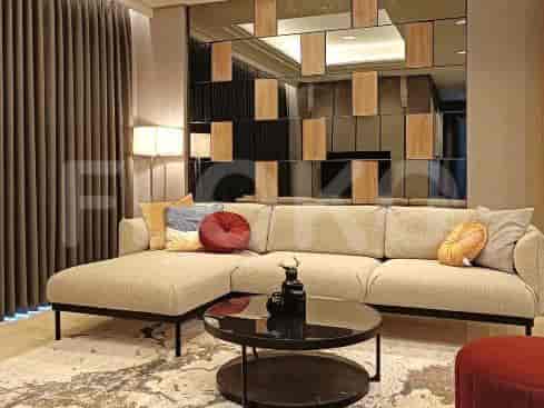 Living room with a sofa and a mirror wall.