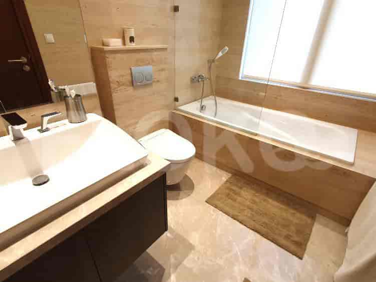 Modern bathroom featuring a bathtub, vanity, and elegant design.