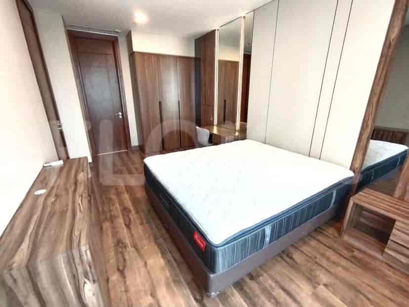 Spacious master bedroom with a queen-size bed, walk-in closet, and a vanity area.