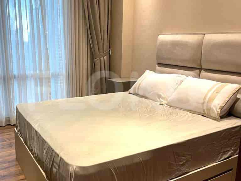 Bedroom with a bed and curtains.