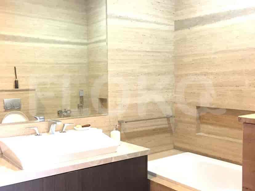 A luxurious bathroom featuring a bathtub and a vanity.