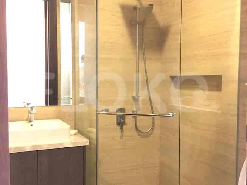 A modern shower area with glass enclosure.