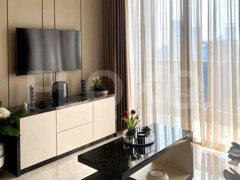 A modern bedroom setup with a queen-sized bed, and large windows offering a city view.