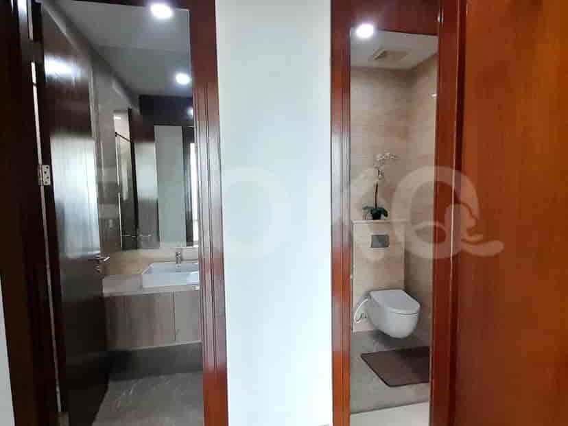 Bathroom with two sinks and a toilet.