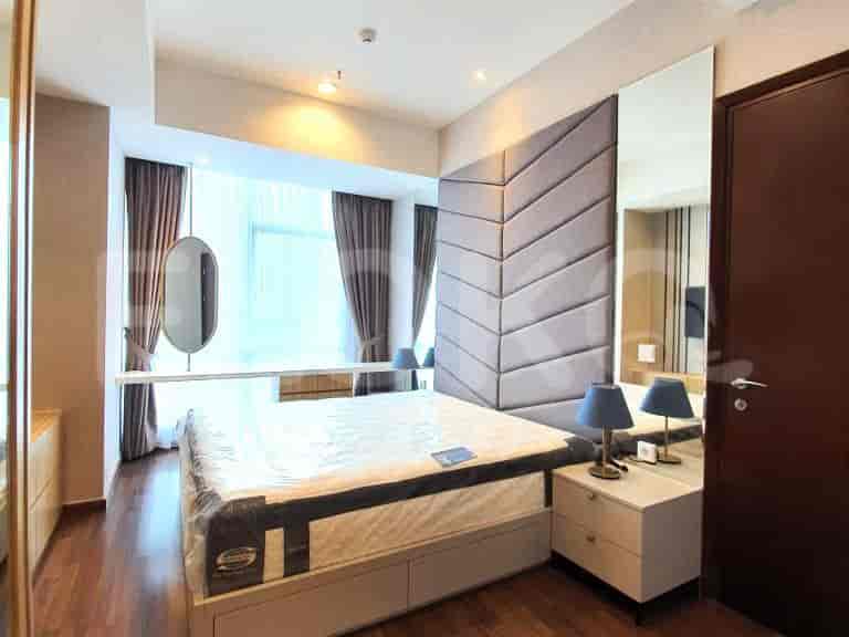 Well-designed bedroom with a bed, nightstands, and a mirror.