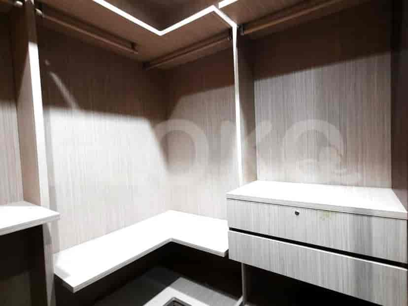 A spacious bathroom with a bathtub, shower, and vanity area.