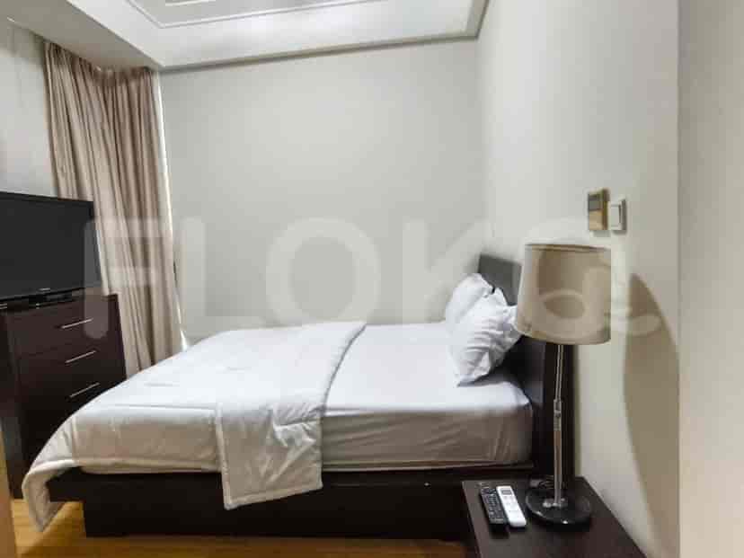 A bedroom with a bed.