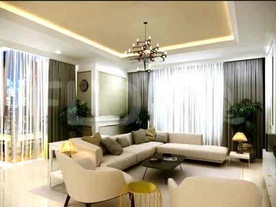 Luxurious living room with a sectional sofa, chandelier, and large windows with curtains.
