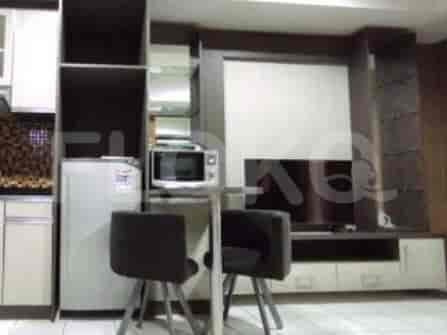 Kitchenette with small dining table and seating.