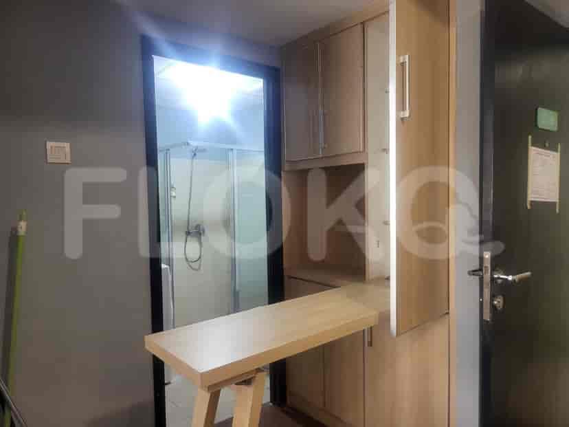 Hallway with a foldable table and cabinets.