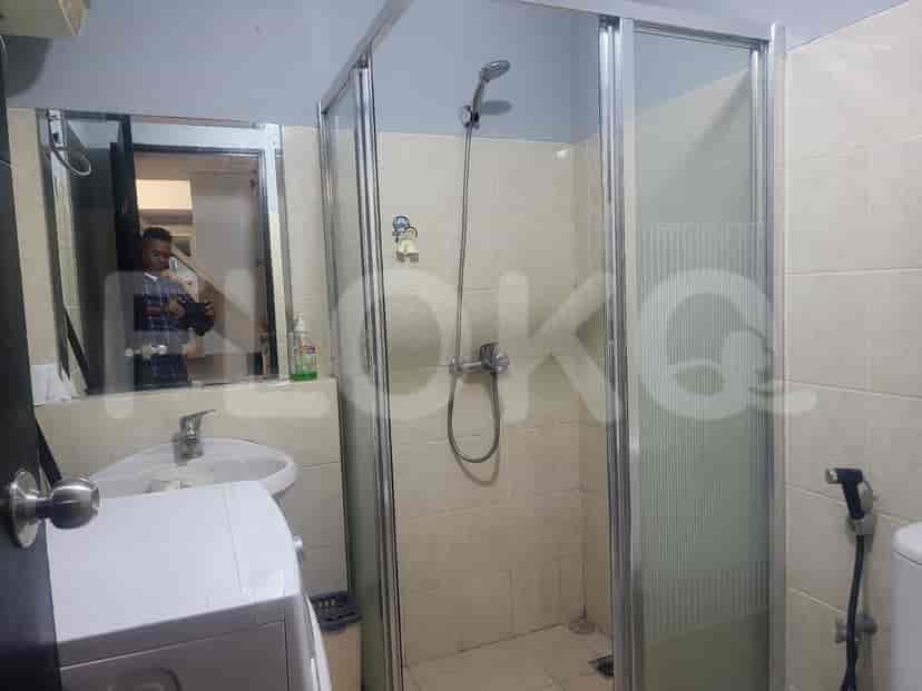 Bathroom with a shower, sink, and a mirror.