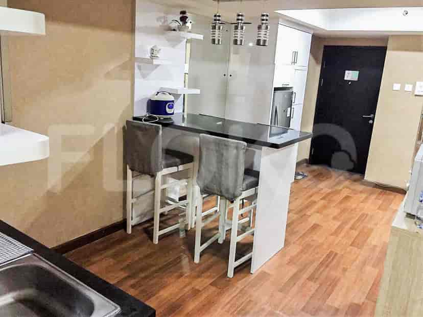 Kitchen with a breakfast bar, bar stools, and a modern design.