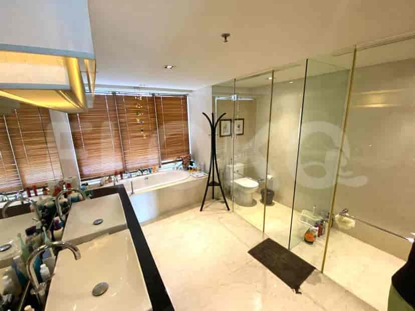 A luxurious bathroom with a bathtub and a separate shower area.