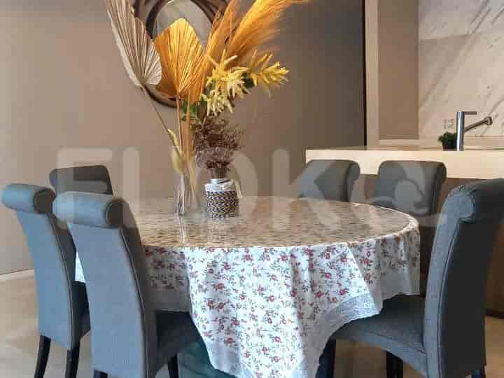 Close-up view of the dining area featuring a floral tablecloth and place settings.