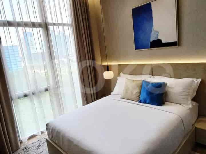 Bedroom featuring a bed with modern design and cityscape views.