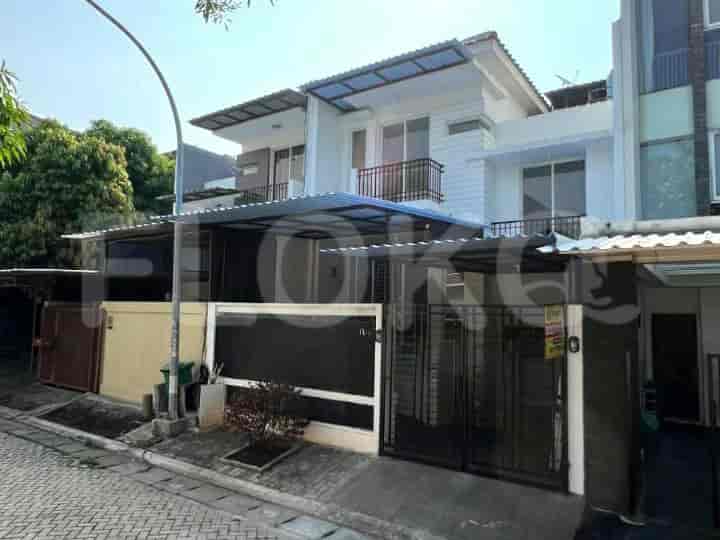 A modern two-story house with a covered carport, black gate, and landscaped front yard.