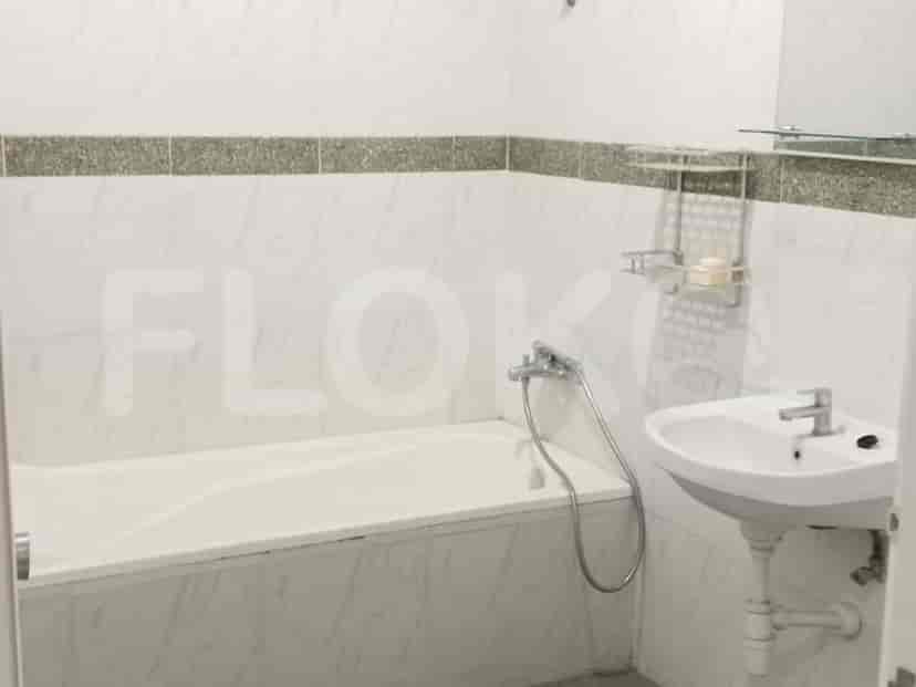 A bathroom with a bathtub and a sink.