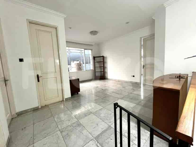 Second-floor living area with a dresser.