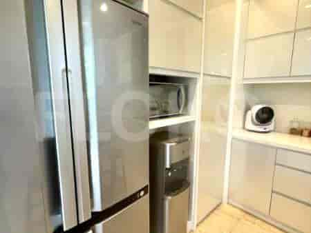 A modern kitchen with stainless steel appliances and white cabinets.