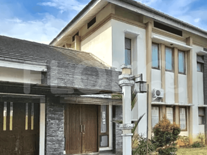 Exterior view of a modern two-story house with a combination of light and dark exterior finishes.