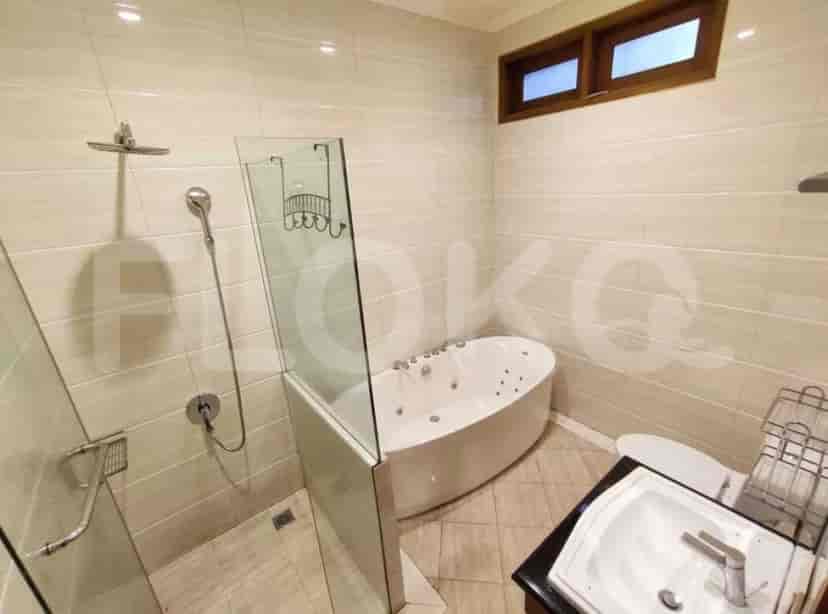 A modern bathroom with a standalone bathtub, a shower, and a vanity with a mirror.