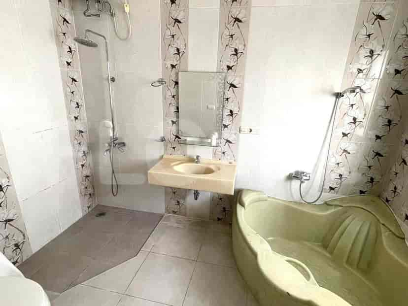 Bathroom featuring a bathtub, shower, and sink area.