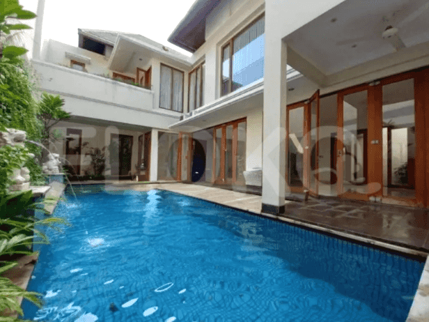 A luxurious villa with a swimming pool and a view of the outdoor terrace.