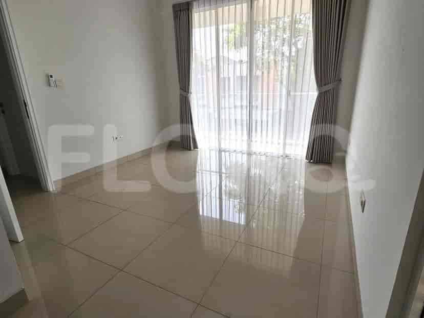 Another bedroom with large windows, curtains, tiled flooring, and access to a balcony.