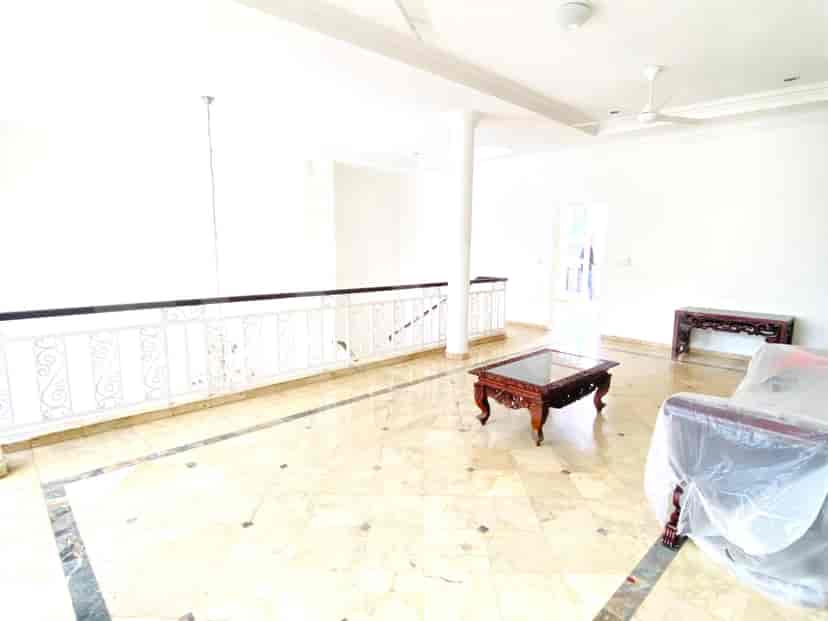 A living room with a coffee table and a balcony.